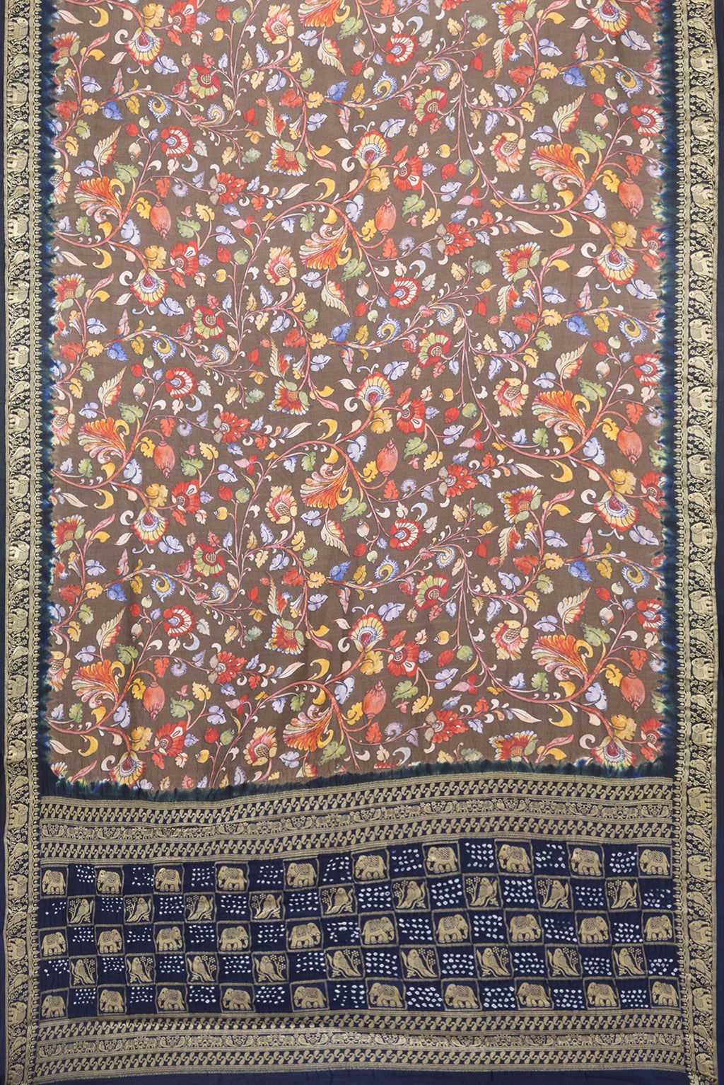 Flat view of Grey kalamkari Saree with Printed design on the body and Zari Border. 