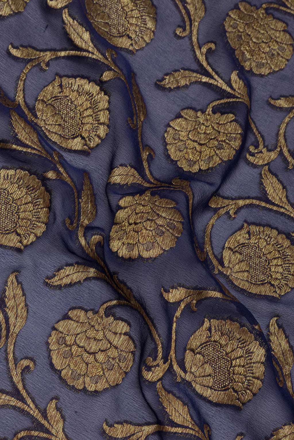 Close up of Navy Blue Banarasi Georgette Saree with Zari Brocade on the body and Zari Border.  displaying folds