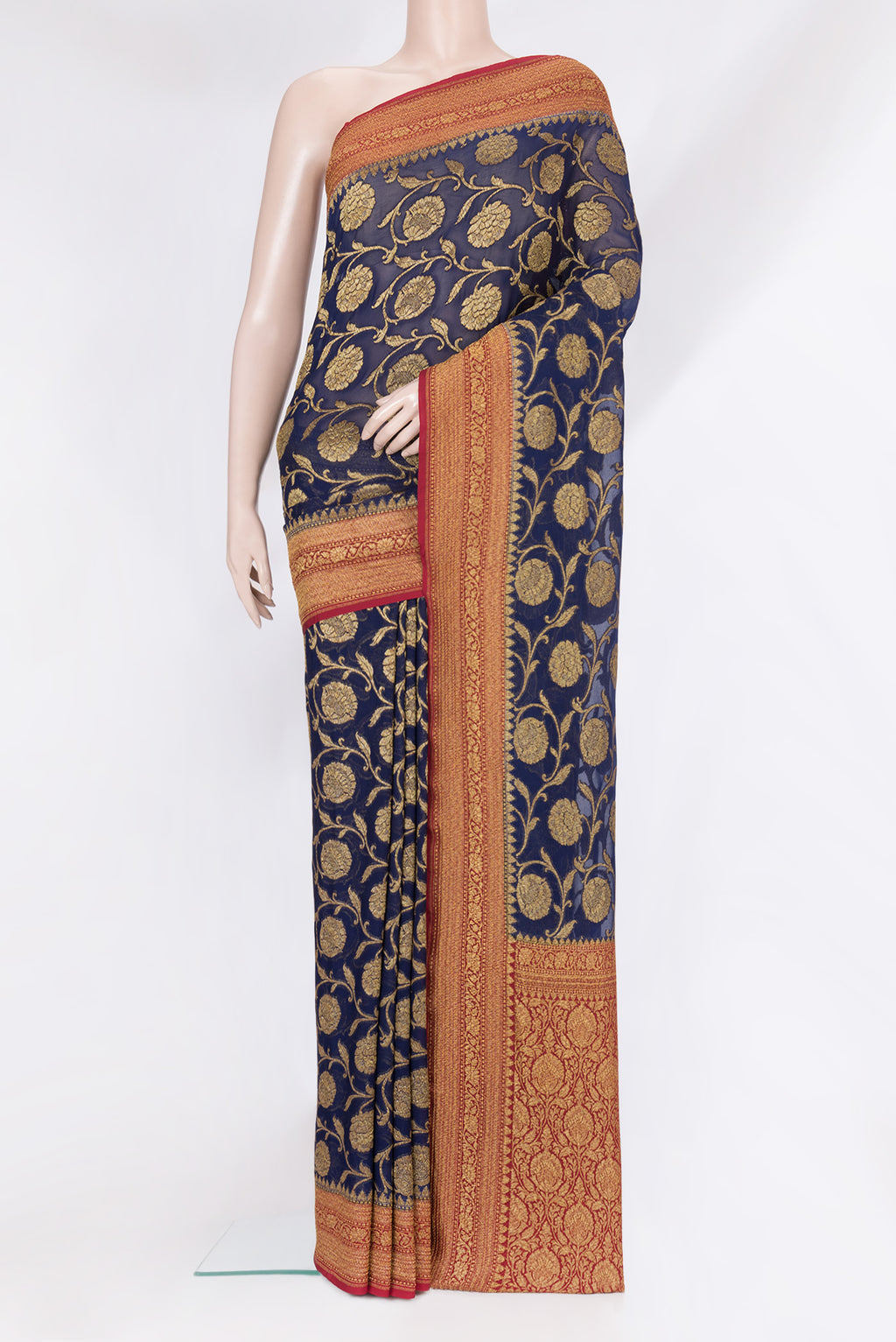 Navy Blue Banarasi Georgette Saree with Zari Brocade on the body and Zari Border.  displayed on a mannequin