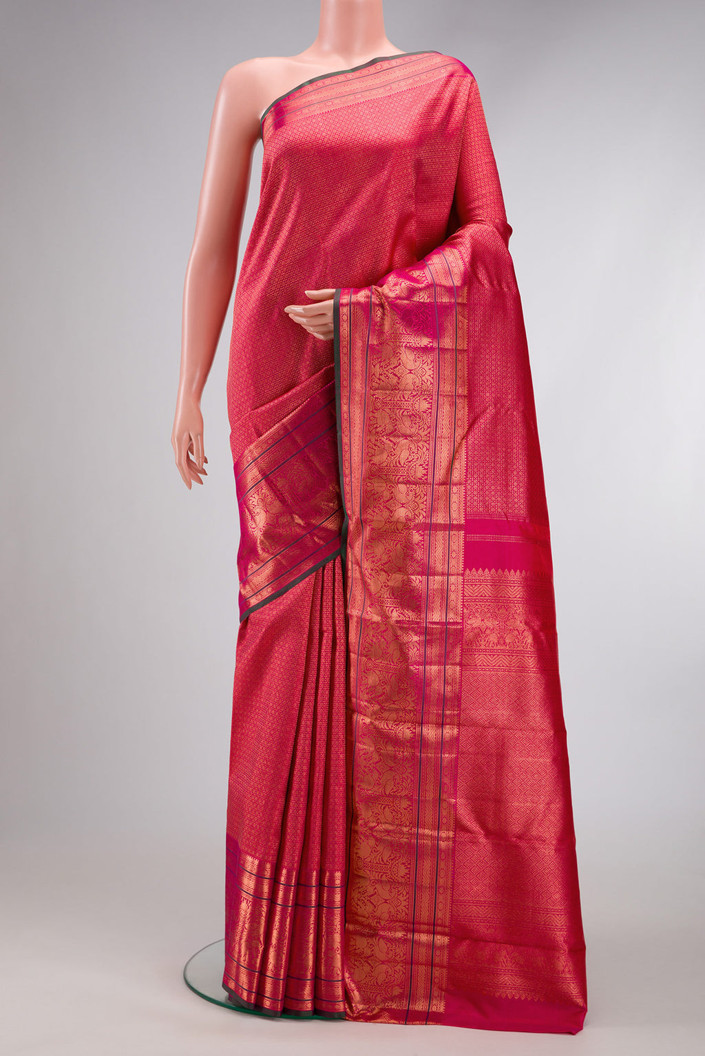 Pink Dual Tone Kanchipuram Silk Saree with Zari Brocade on the body and Zari Border.  displayed on a mannequin