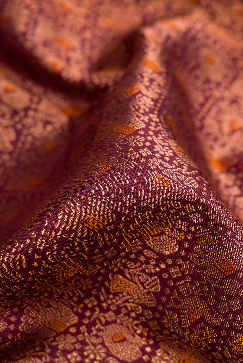 Close up of Coffee Brown Dual Tone Kanchipuram Silk Saree with Zari Brocade on the body and Fancy Border.  displaying folds