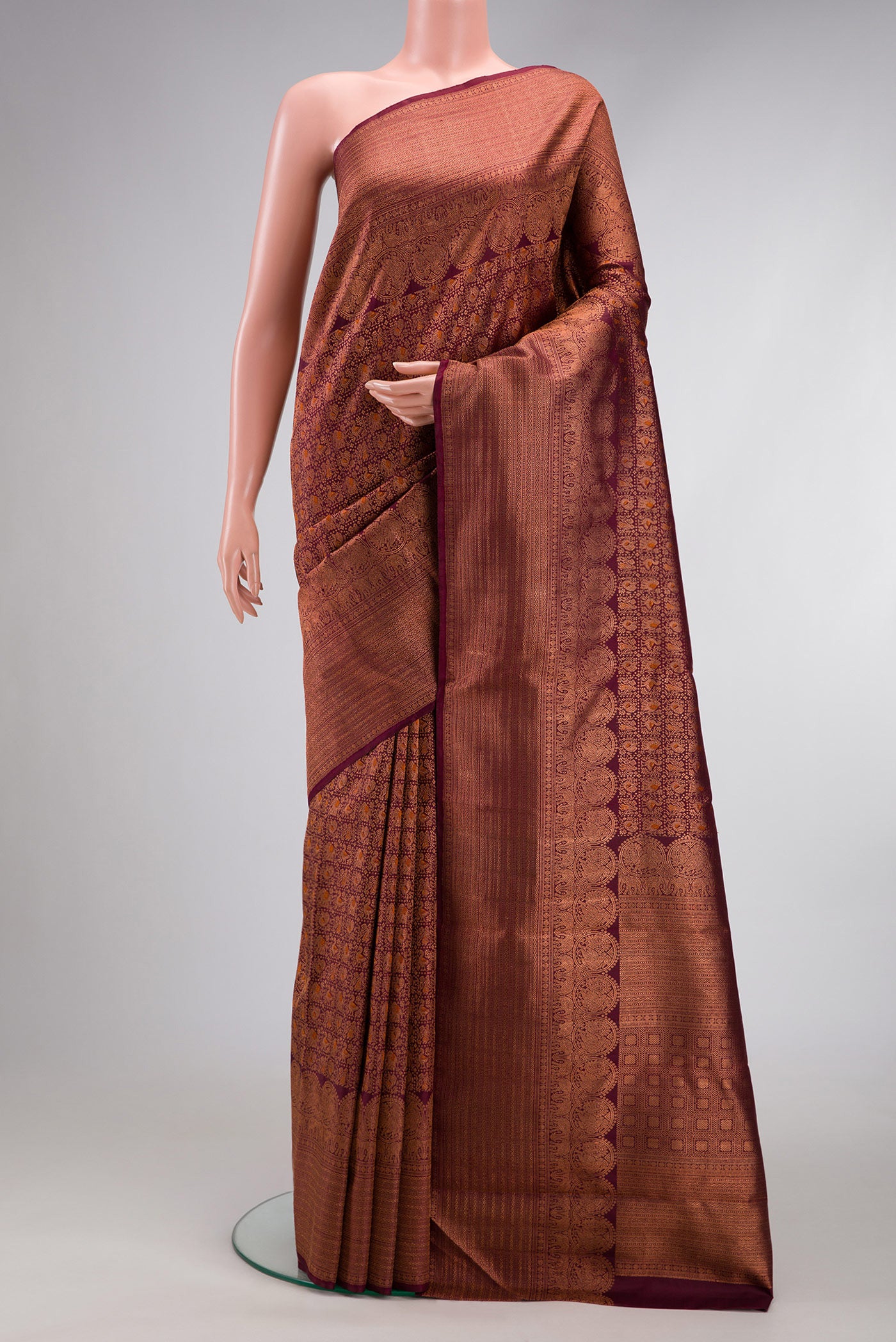 Coffee Brown Dual Tone Kanchipuram Silk Saree with Zari Brocade on the body and Fancy Border.  displayed on a mannequin