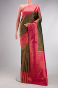 Bottle Green Dual Tone Kanchipuram Silk Saree with Zari Brocade on the body and Fancy Border.  displayed on a mannequin