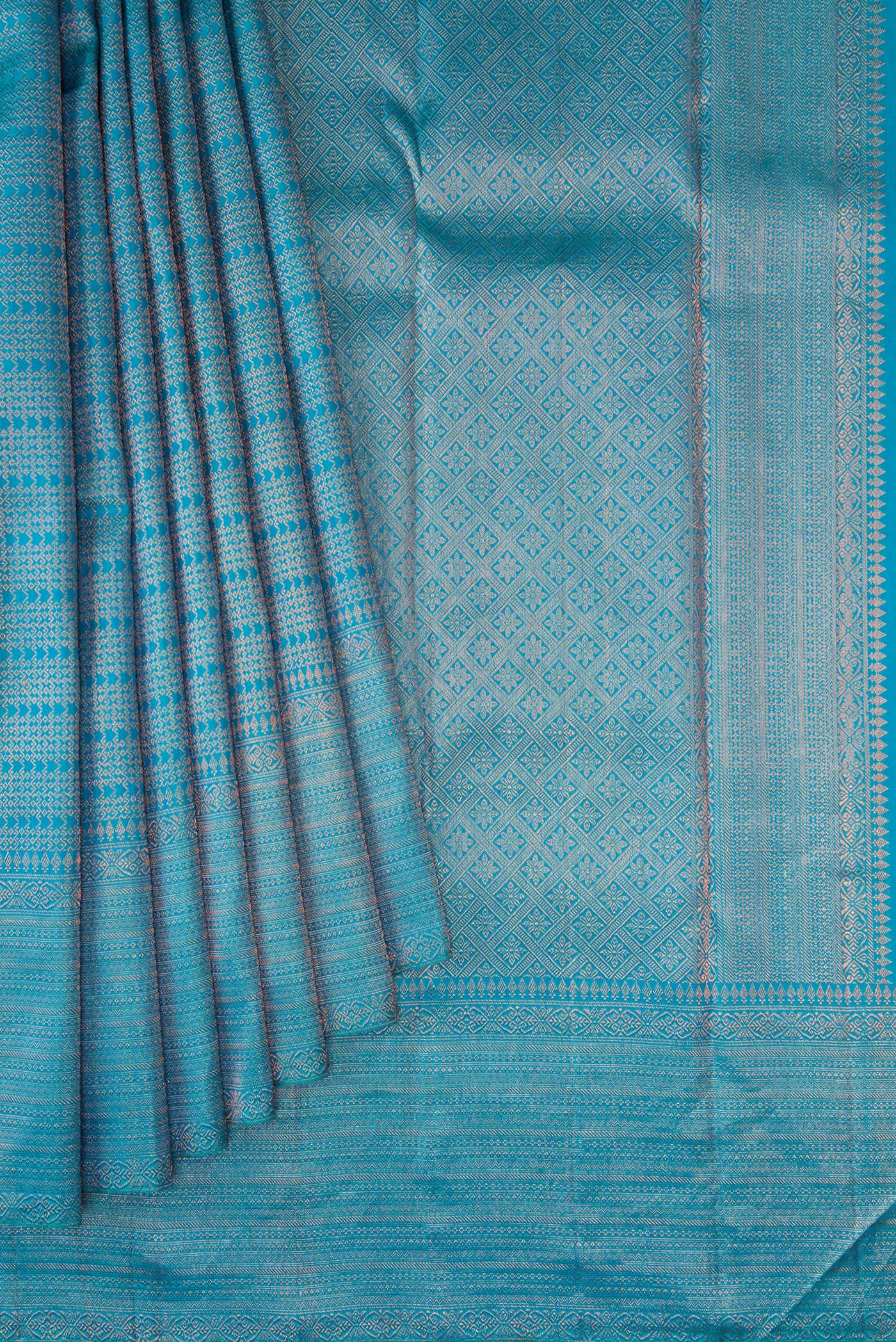 Pleats and pallu of Peacock Blue Dual Tone Kanjivaram Silk Saree with Zari Brocade on the body and Fancy Border. 