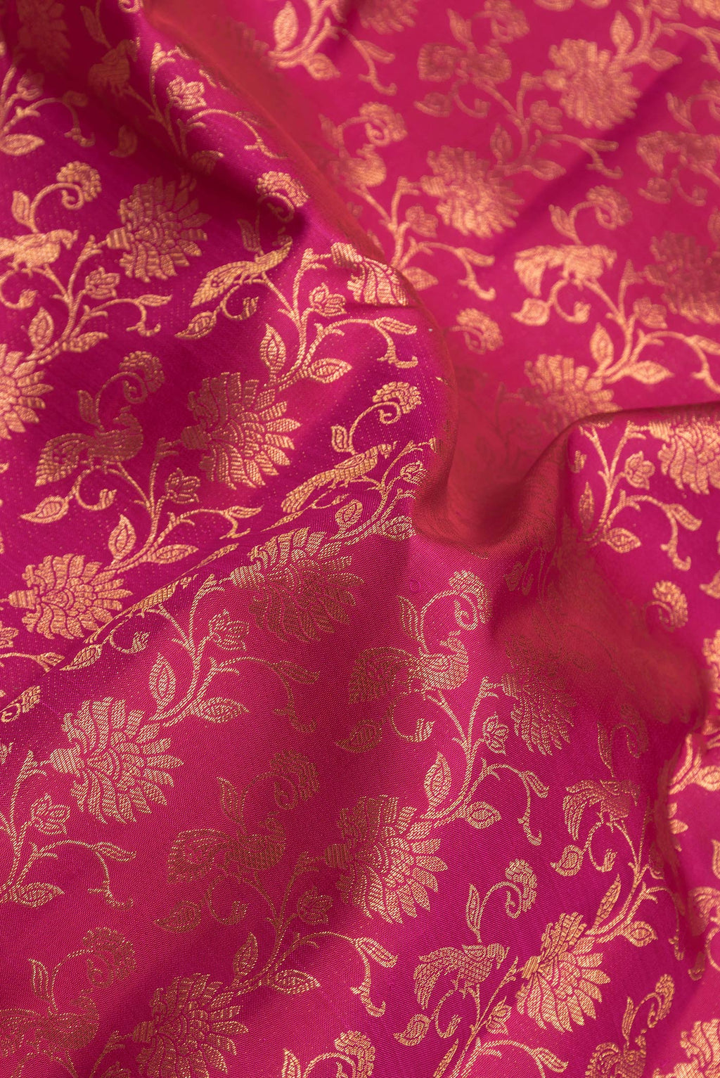 Close up of Pink Dual Tone Kanchipuram Silk Saree with Zari Brocade on the body and Zari Border.  displaying folds