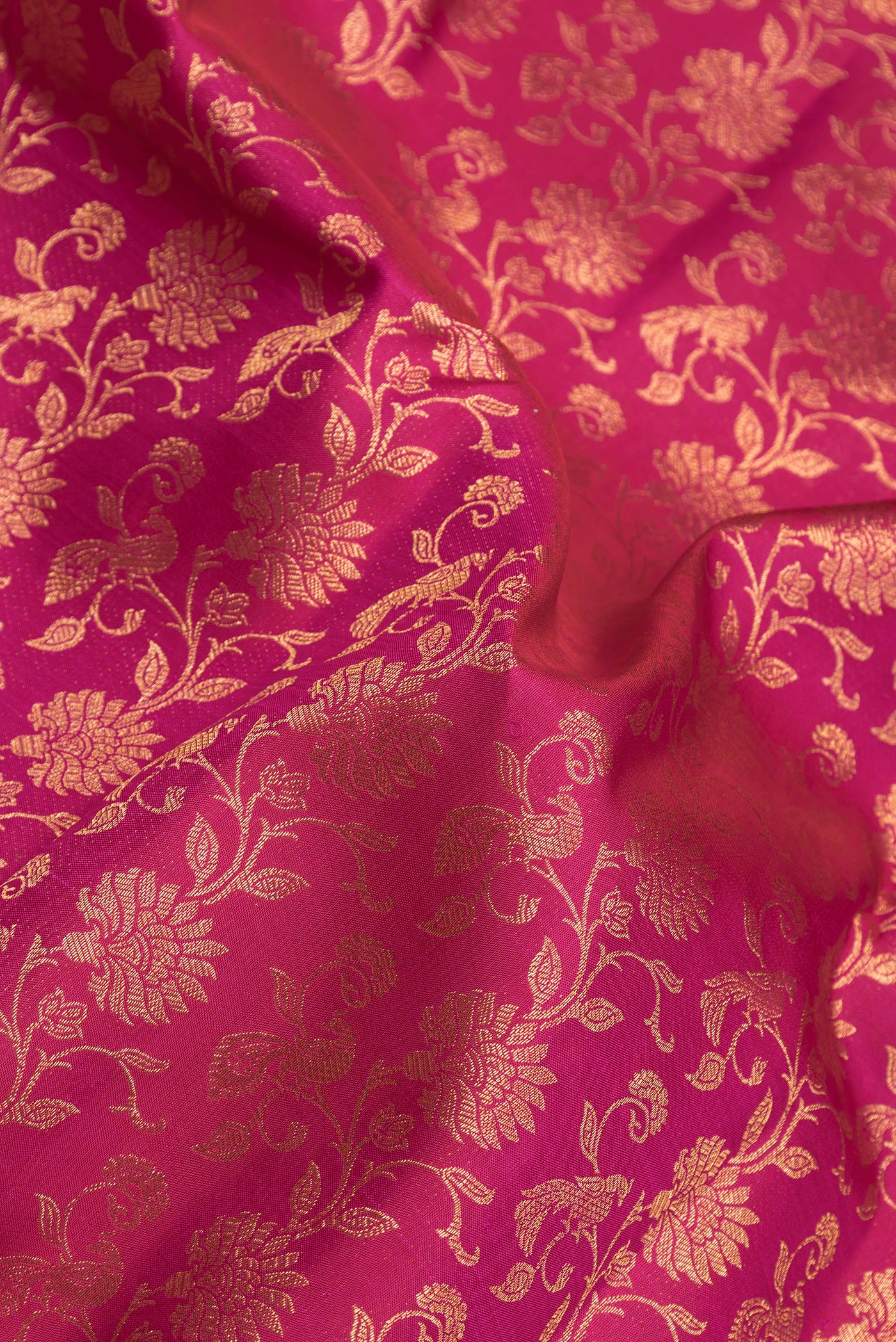 Close up of Pink Dual Tone Kanchipuram Silk Saree with Zari Brocade on the body and Zari Border.  displaying folds