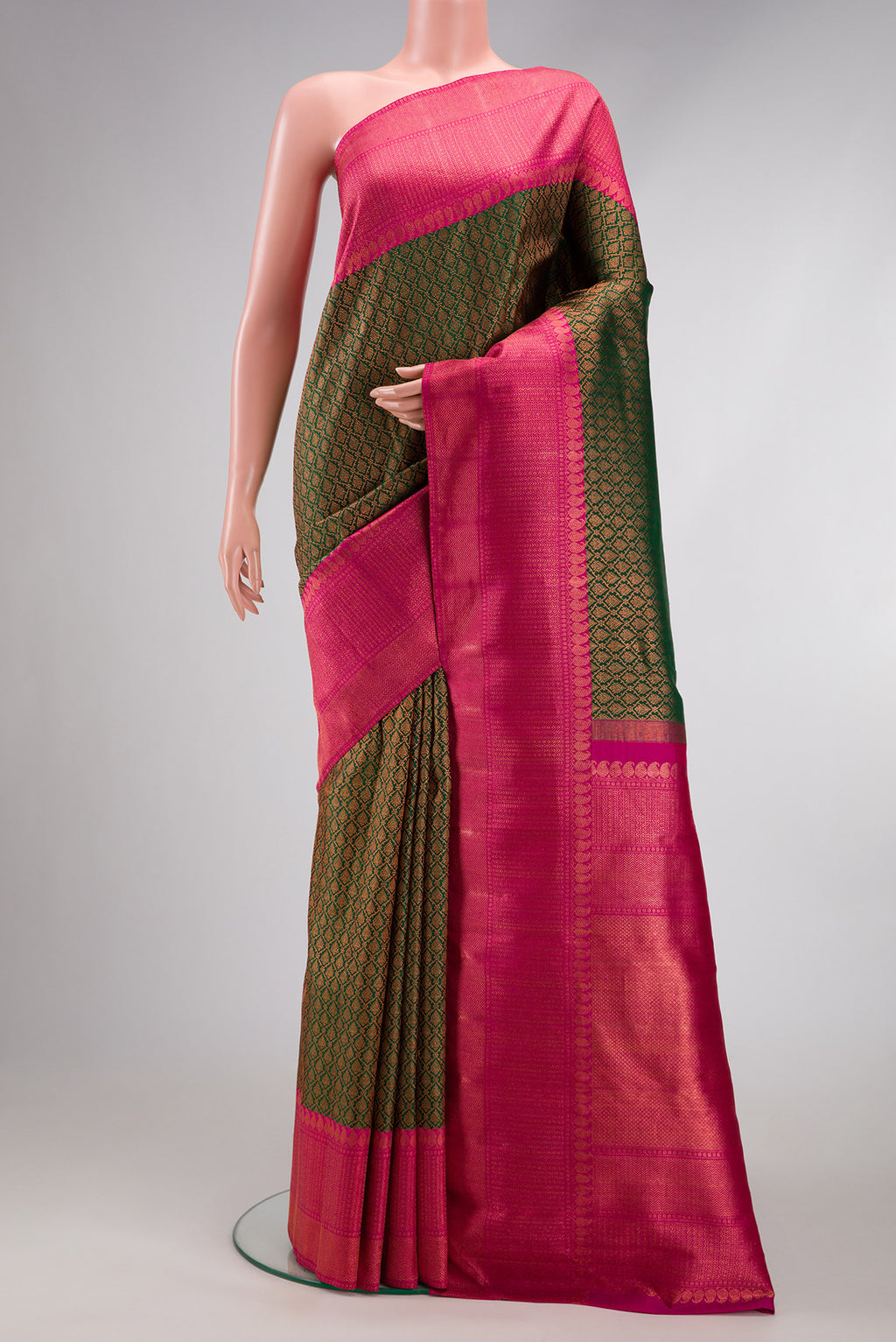 Bottle Green Dual Tone Kanchipuram Silk Saree with Zari Brocade on the body and Zari Border.  displayed on a mannequin