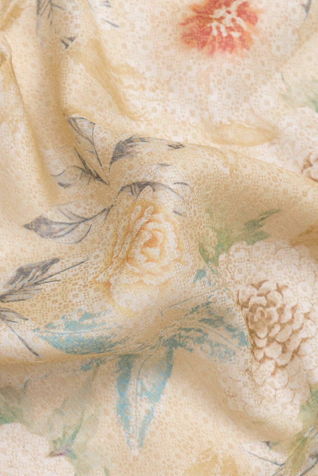 Close up of Beige Dual Tone Tussar Silk Saree with Printed design on the body and Zari Border.  displaying folds
