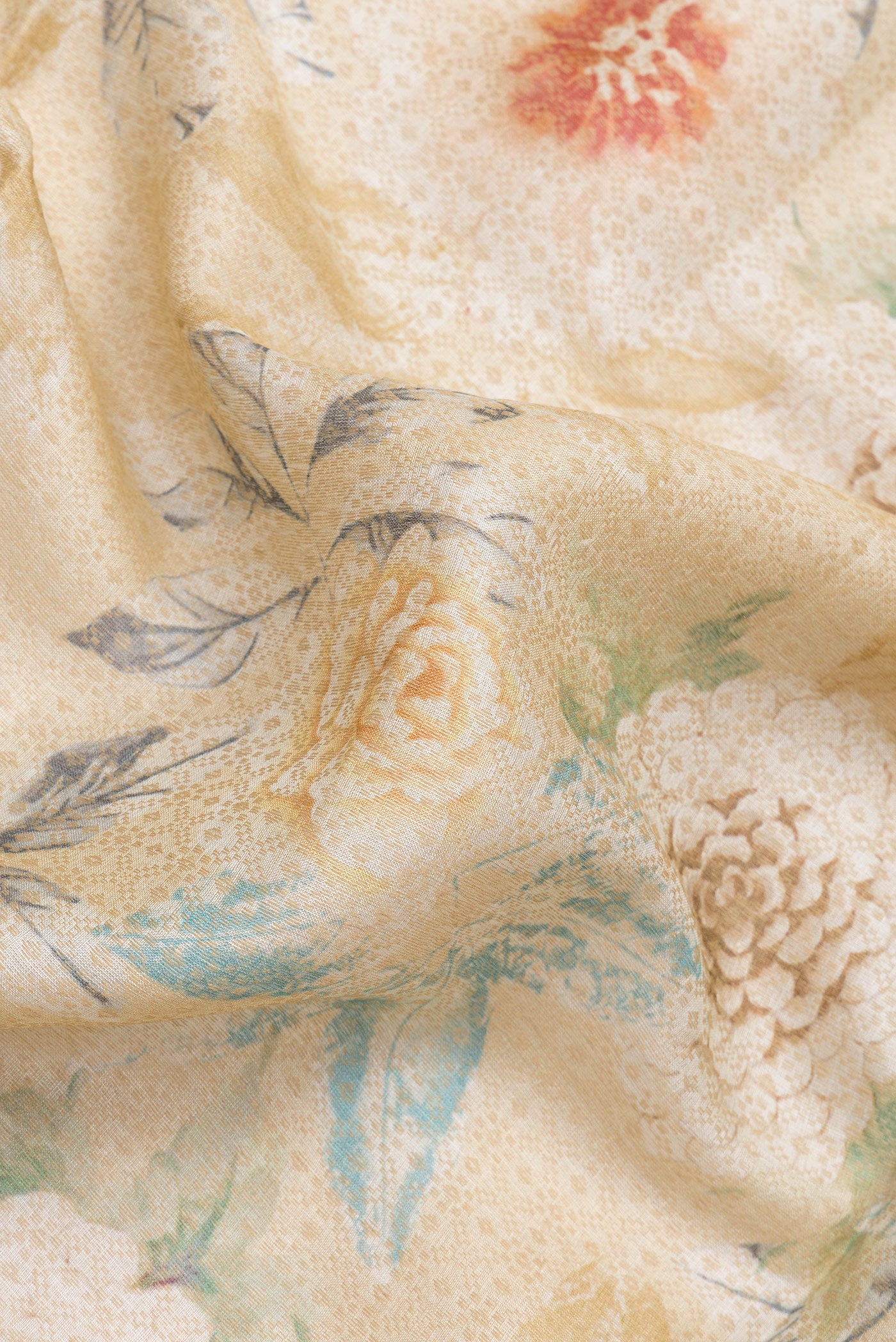 Close up of Beige Dual Tone Tussar Silk Saree with Printed design on the body and Zari Border.  displaying folds