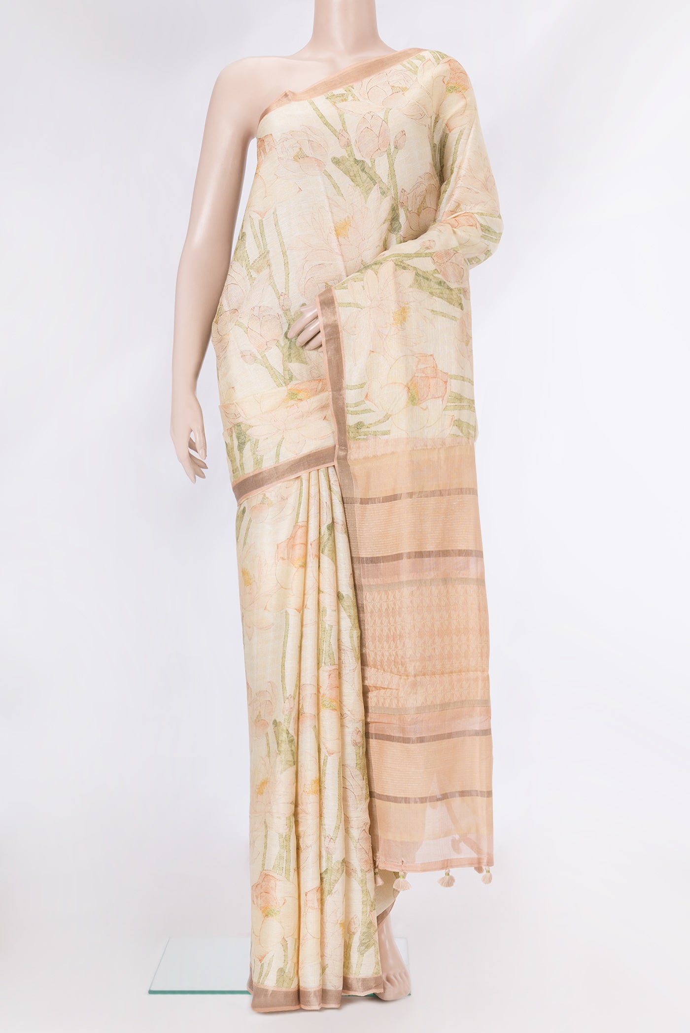 Beige Dual Tone Tussar Silk Saree with Printed design on the body and Zari Border.  displayed on a mannequin