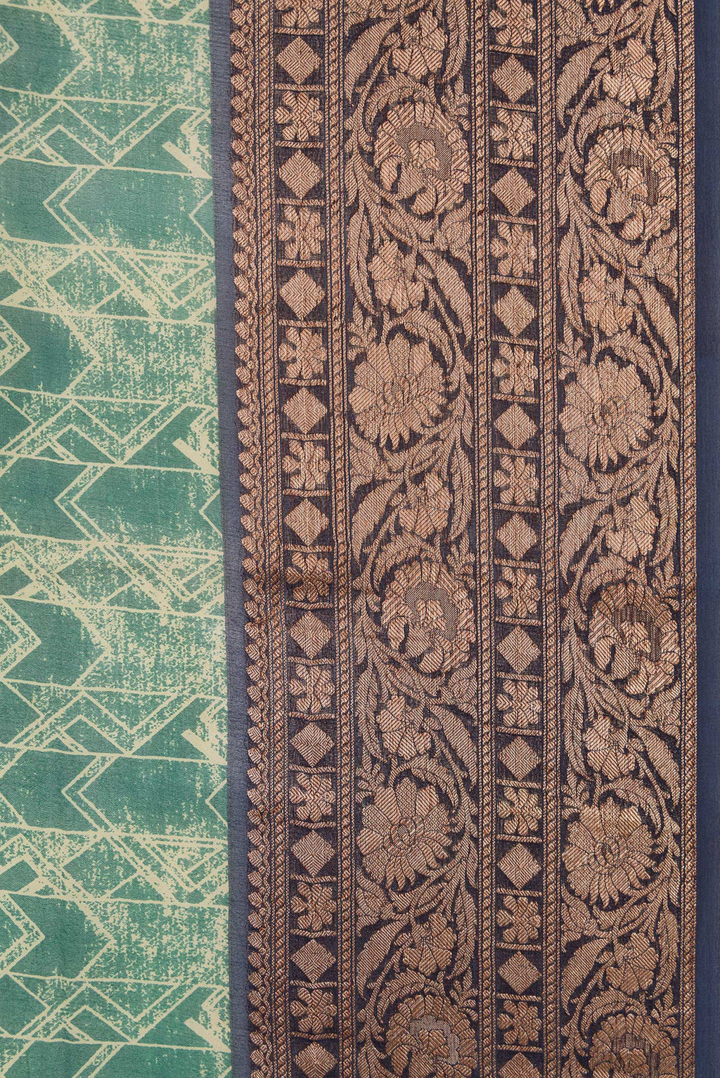 Border image of Green Dual Tone Organza Silk Saree with Printed design on the body and Zari Border. 