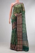 Green Dual Tone Organza Silk Saree with Printed design on the body and Zari Border.  displayed on a mannequin