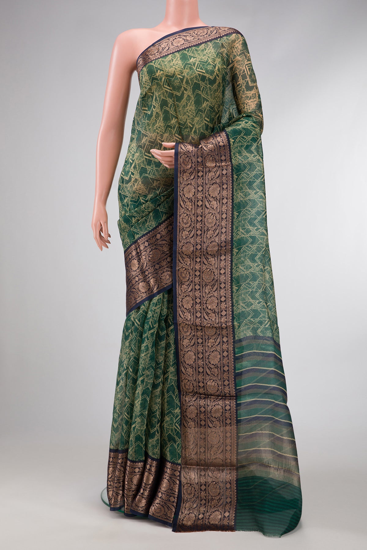 Green Dual Tone Organza Silk Saree with Printed design on the body and Zari Border.  displayed on a mannequin