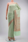 Green Banarasi Georgette Saree with Zari Butta on the body and Zari Border displayed on a mannequin