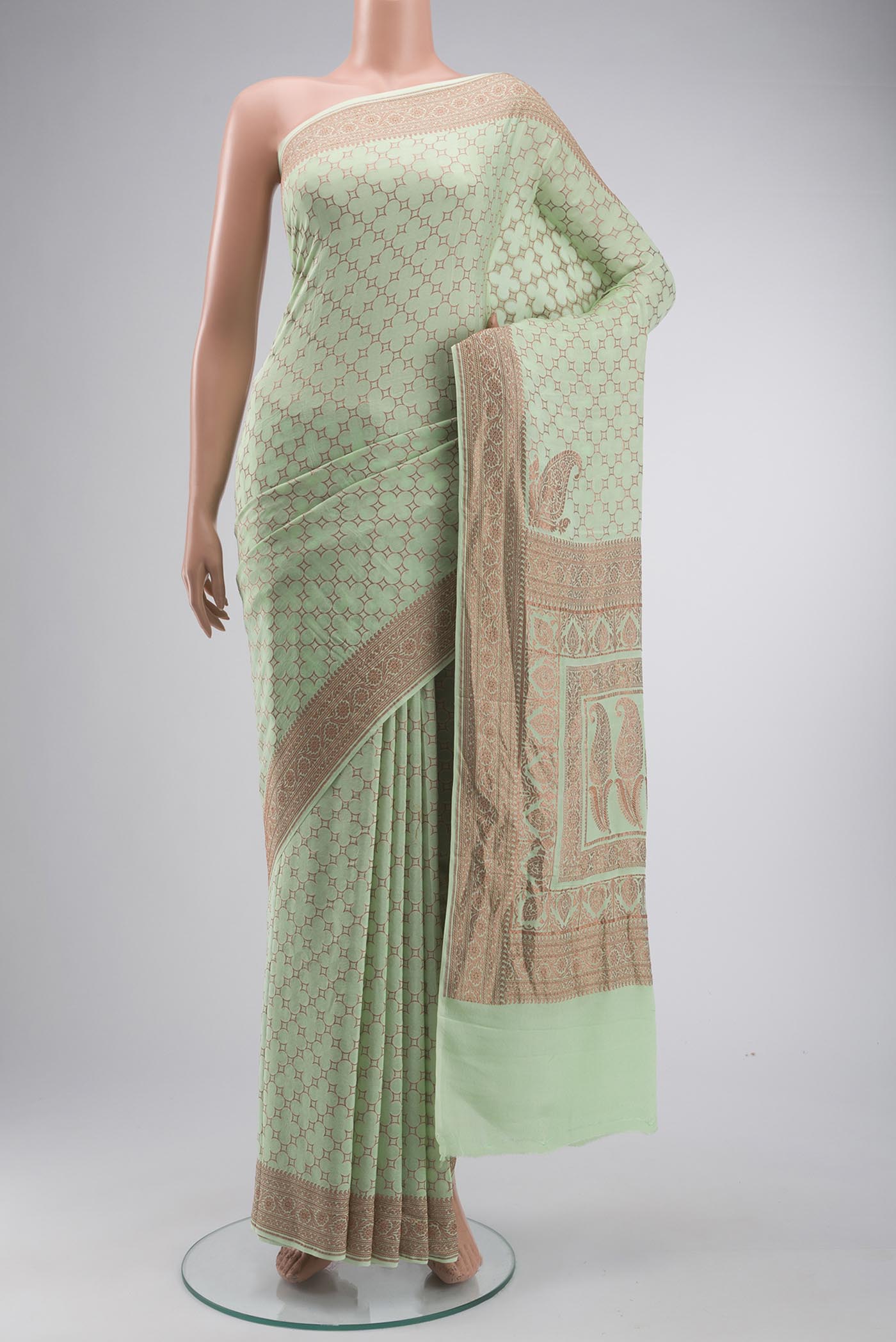 Green Banarasi Georgette Saree with Zari Butta on the body and Zari Border displayed on a mannequin