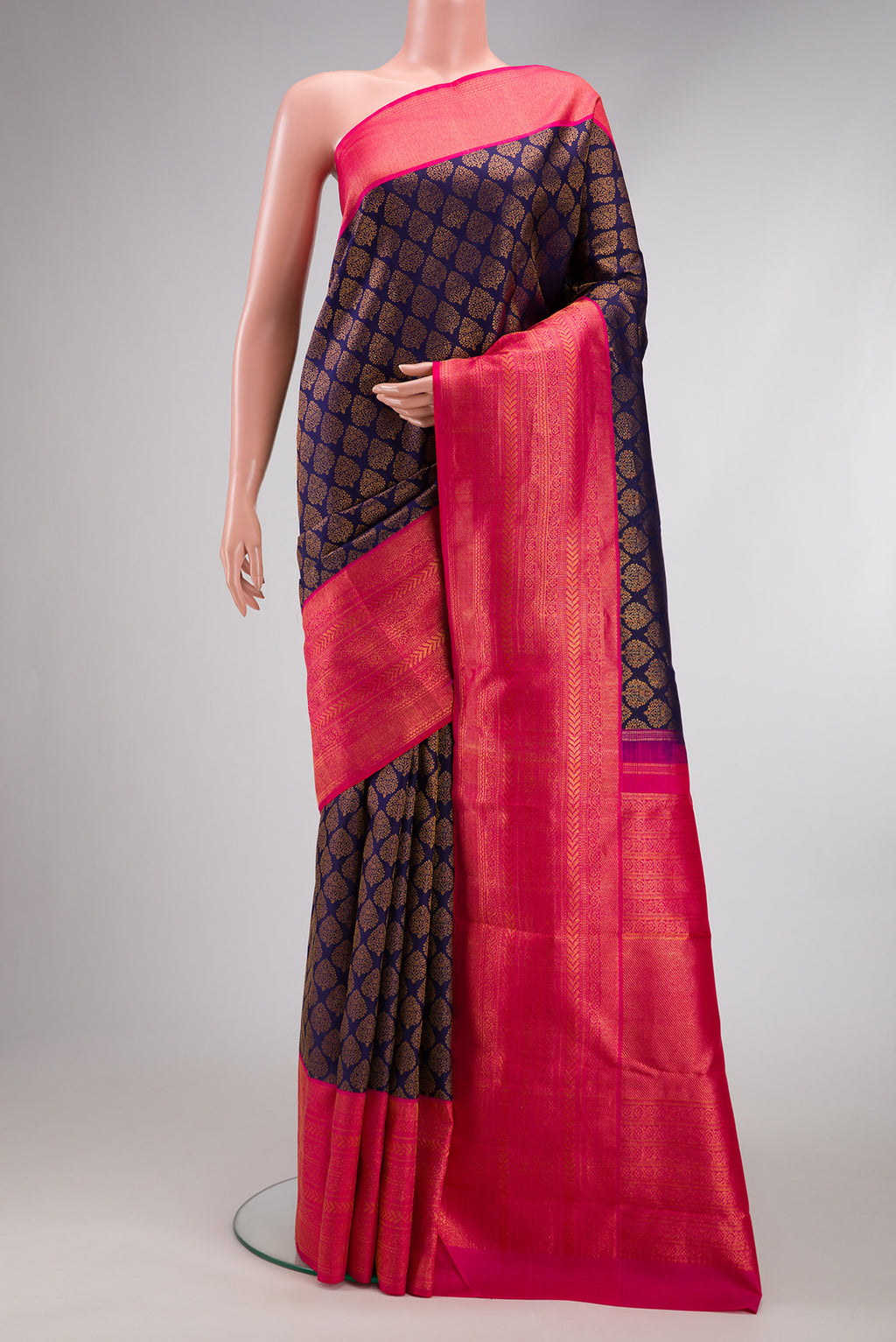 Navy Blue Dual Tone Kanchipuram Silk Saree with Zari Brocade on the body and Zari Border.  displayed on a mannequin