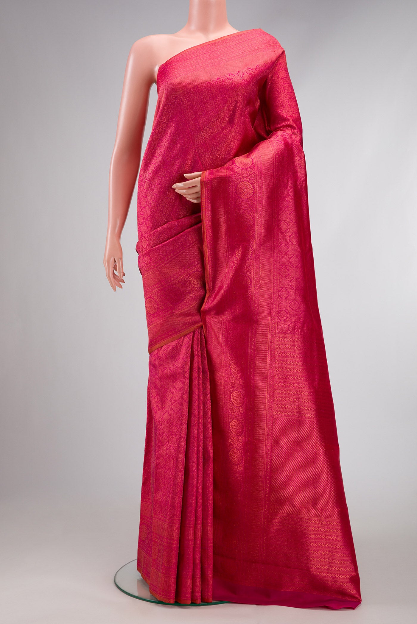 Pink Dual Tone Kanjivaram Silk Saree with Zari Brocade on the body and Zari Border.  displayed on a mannequin