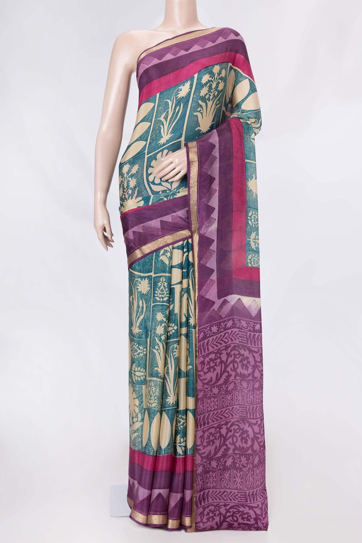 Green Dual Tone Mysore Crepe Saree with Printed design on the body and Zari Border displayed on a mannequin