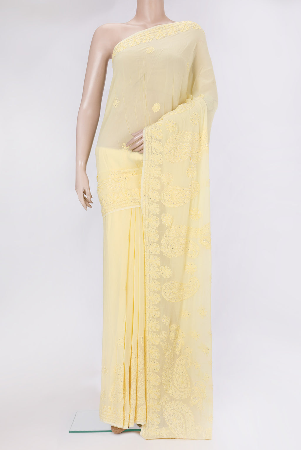 Yellow Georgette Saree with Embroidery on the body and Embroidery Border.  displayed on a mannequin