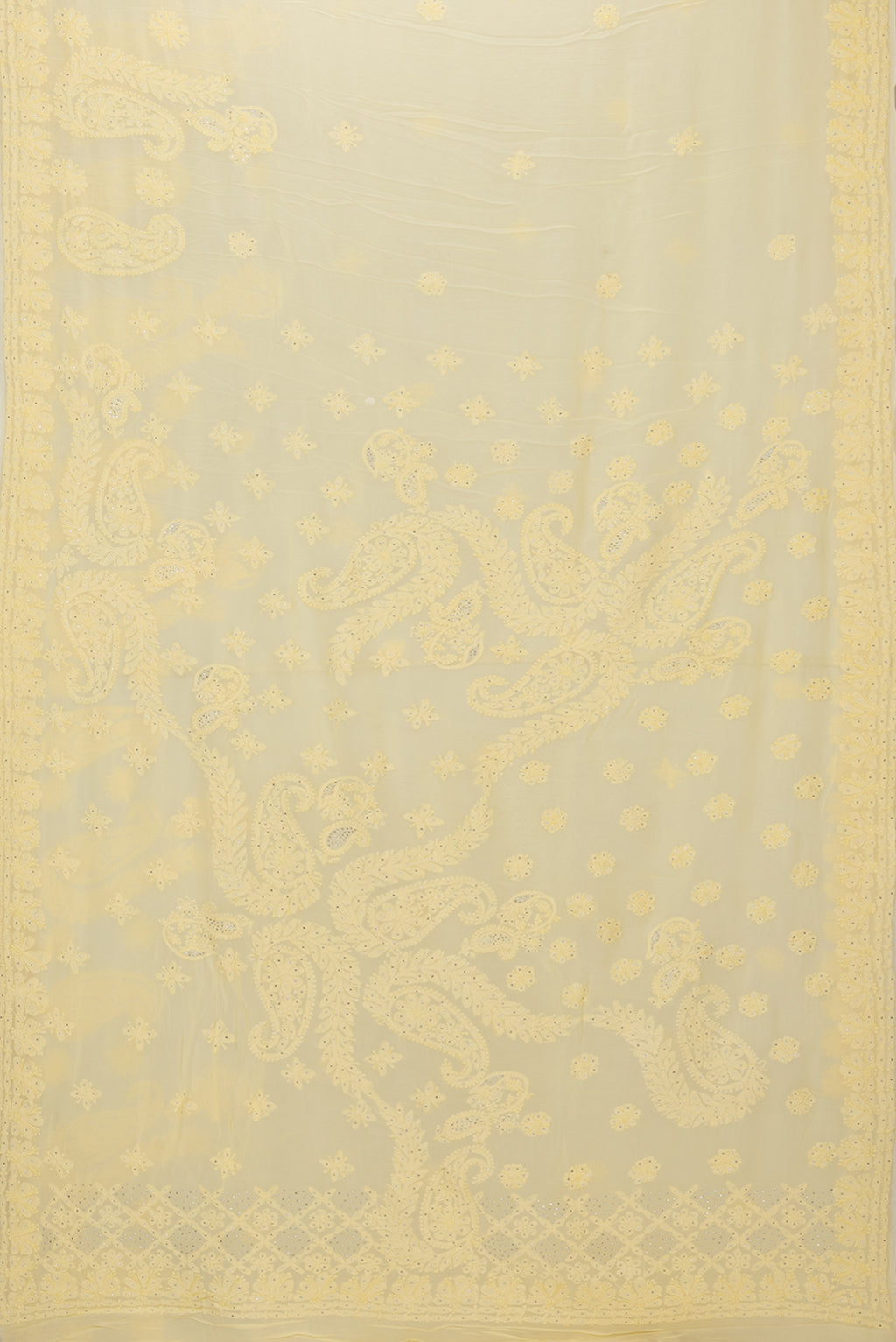 Flat view of Yellow Georgette Saree with Embroidery on the body and Embroidery Border. 