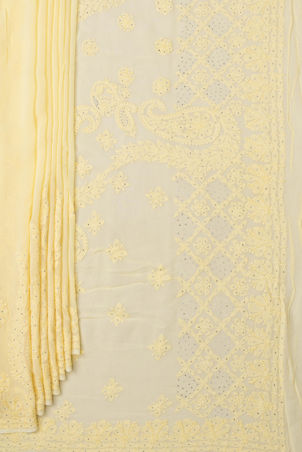 Pleats and pallu of Yellow Georgette Saree with Embroidery on the body and Embroidery Border. 