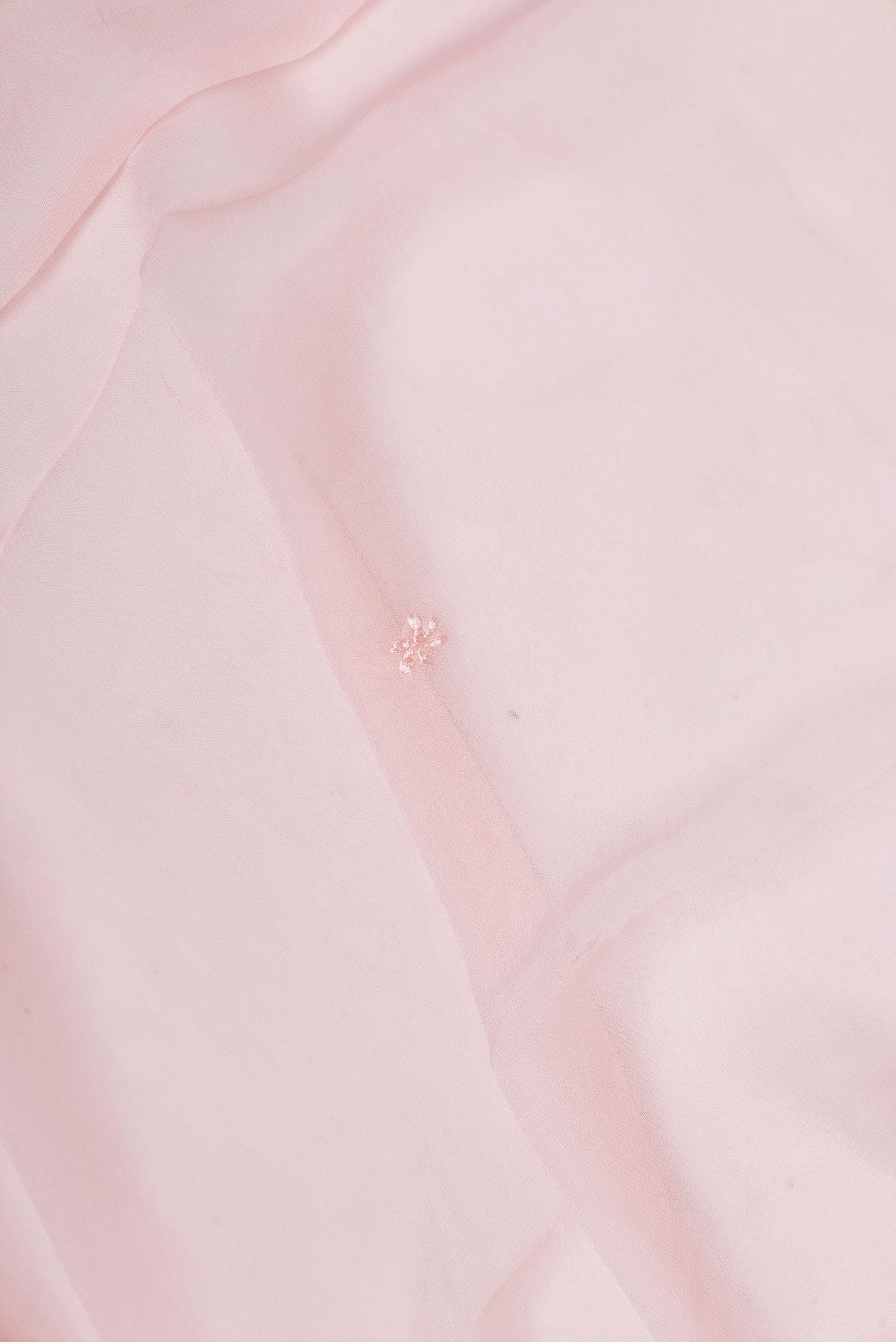 Close up of Rose pink Dual Tone Mysore Georgette Saree with Embroidery on the body and Embroidery Border displaying folds