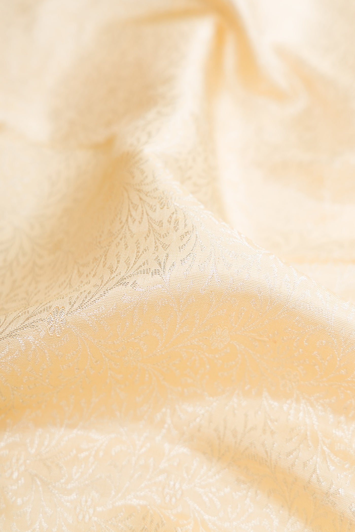 Close up of Sandal Dual Tone Kanchipuram Silk Saree with Zari Brocade on the body and Fancy Border.  displaying folds