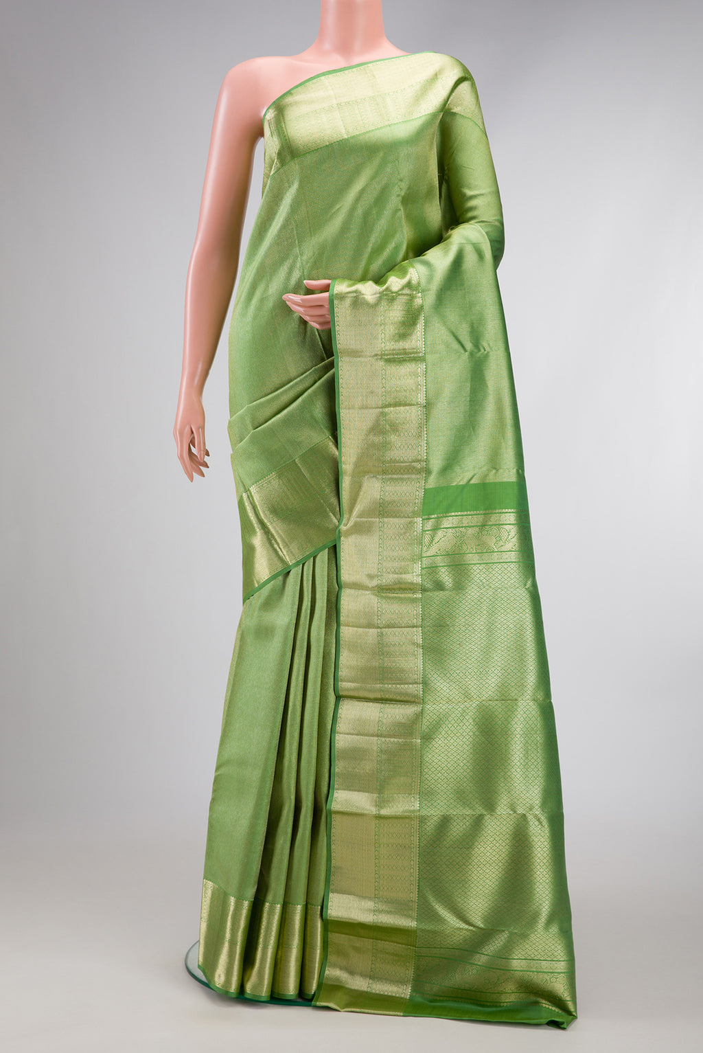 Pista Green Dual Tone Kanchipuram Silk Saree with Zari Brocade on the body and Zari Border.  displayed on a mannequin