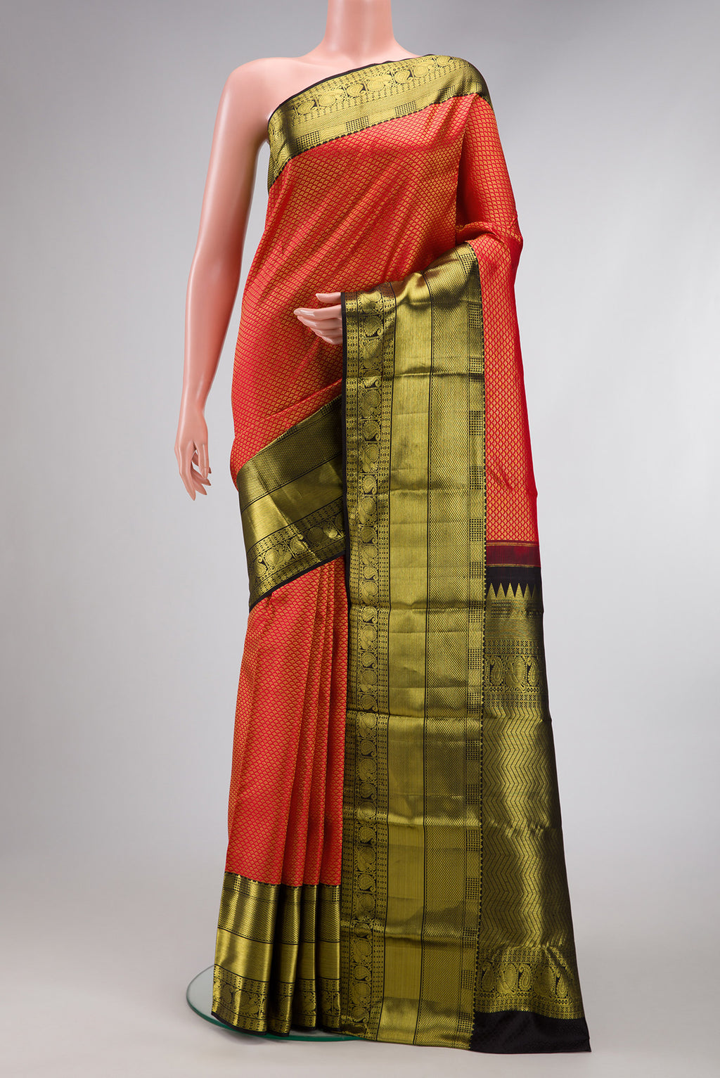 Red Dual Tone Kanchipuram Silk Saree with Zari Brocade on the body and Zari Border.  displayed on a mannequin