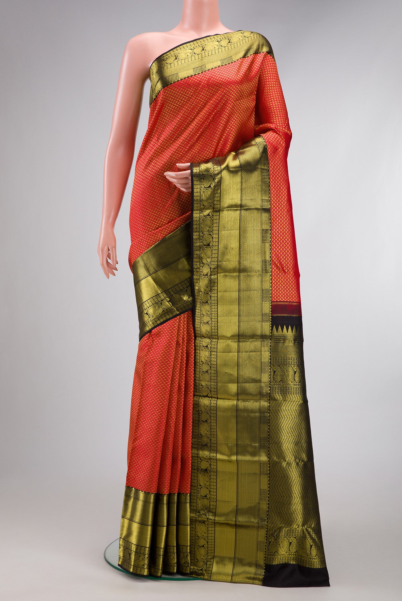 Red Dual Tone Kanchipuram Silk Saree with Zari Brocade on the body and Zari Border.  displayed on a mannequin