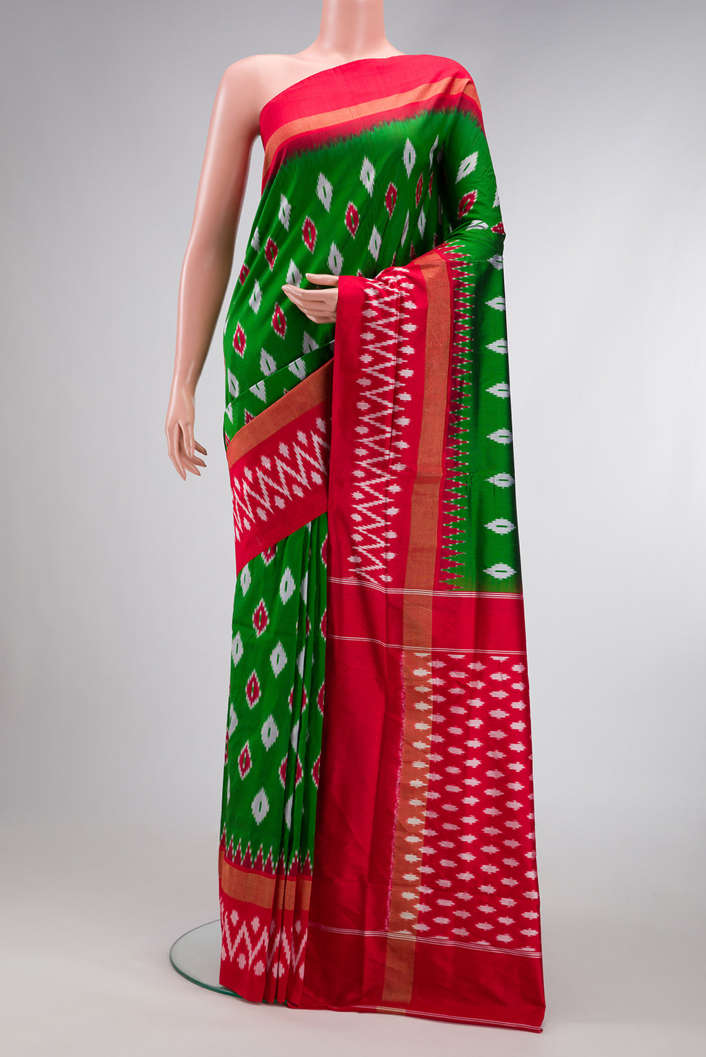 Parrot Green Dual Tone Double Ikat Saree with Ikat Print on the body and Zari Border.  displayed on a mannequin