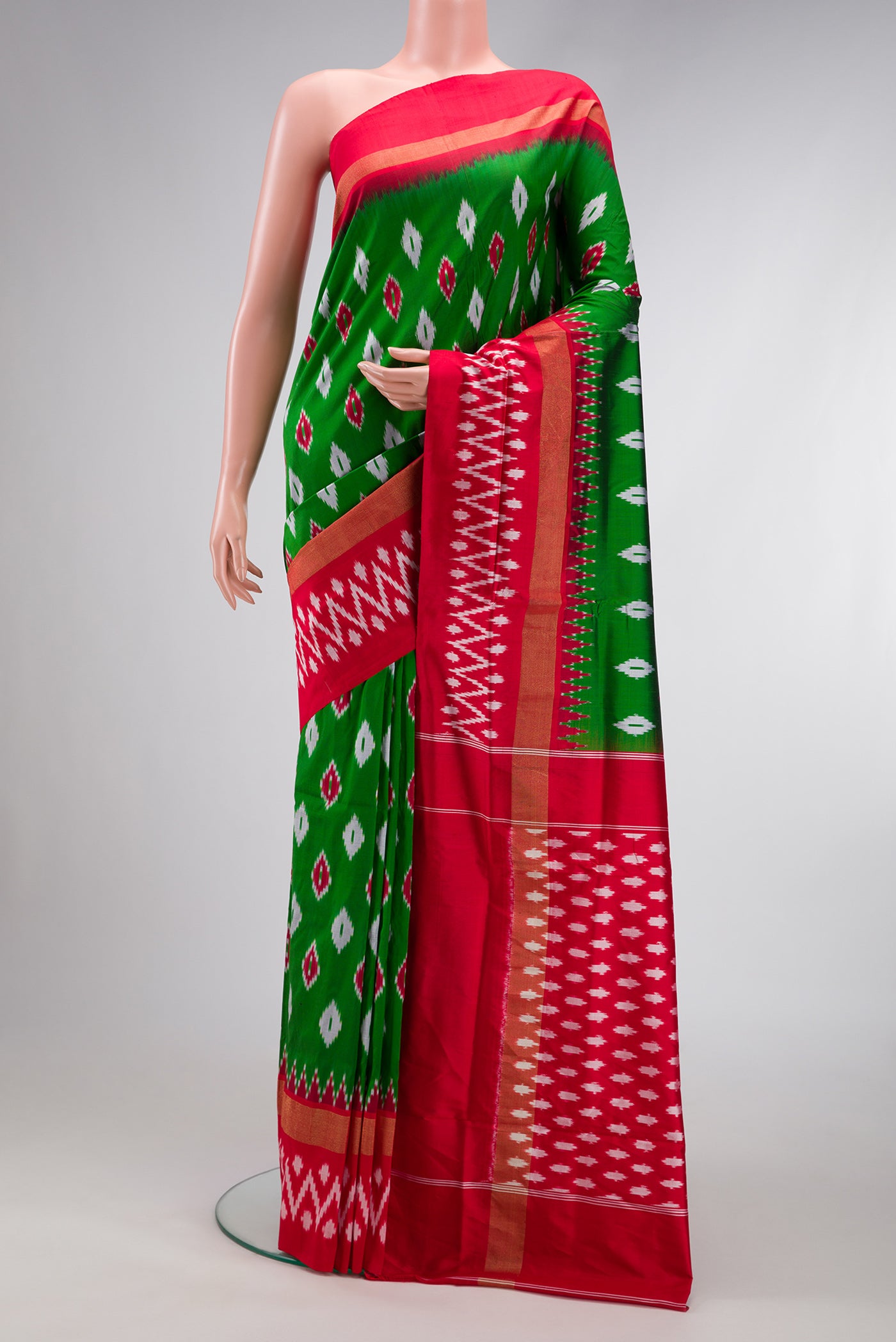Parrot Green Dual Tone Double Ikat Saree with Ikat Print on the body and Zari Border.  displayed on a mannequin