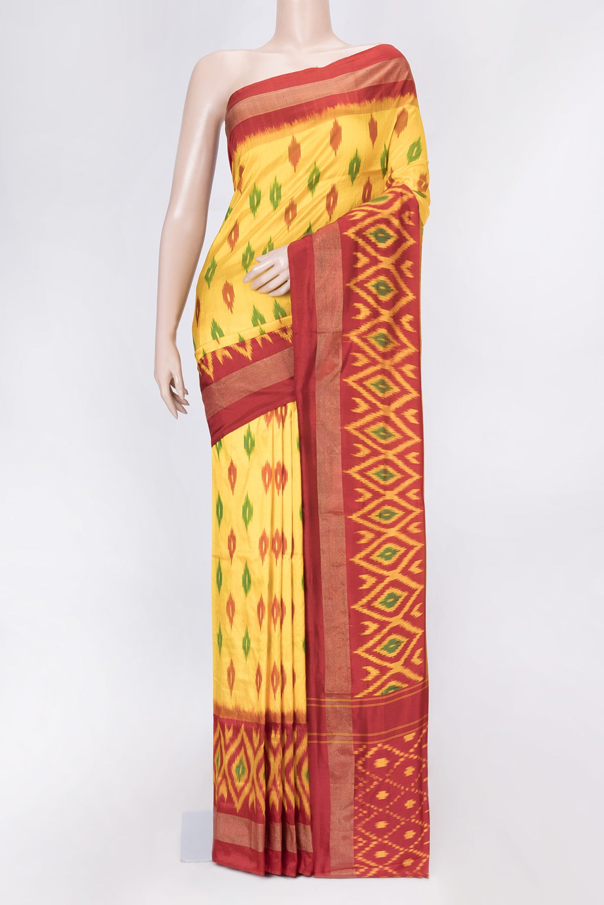 Yellow Dual Tone Double Ikat Saree with Ikat Print on the body and Zari Border displayed on a mannequin