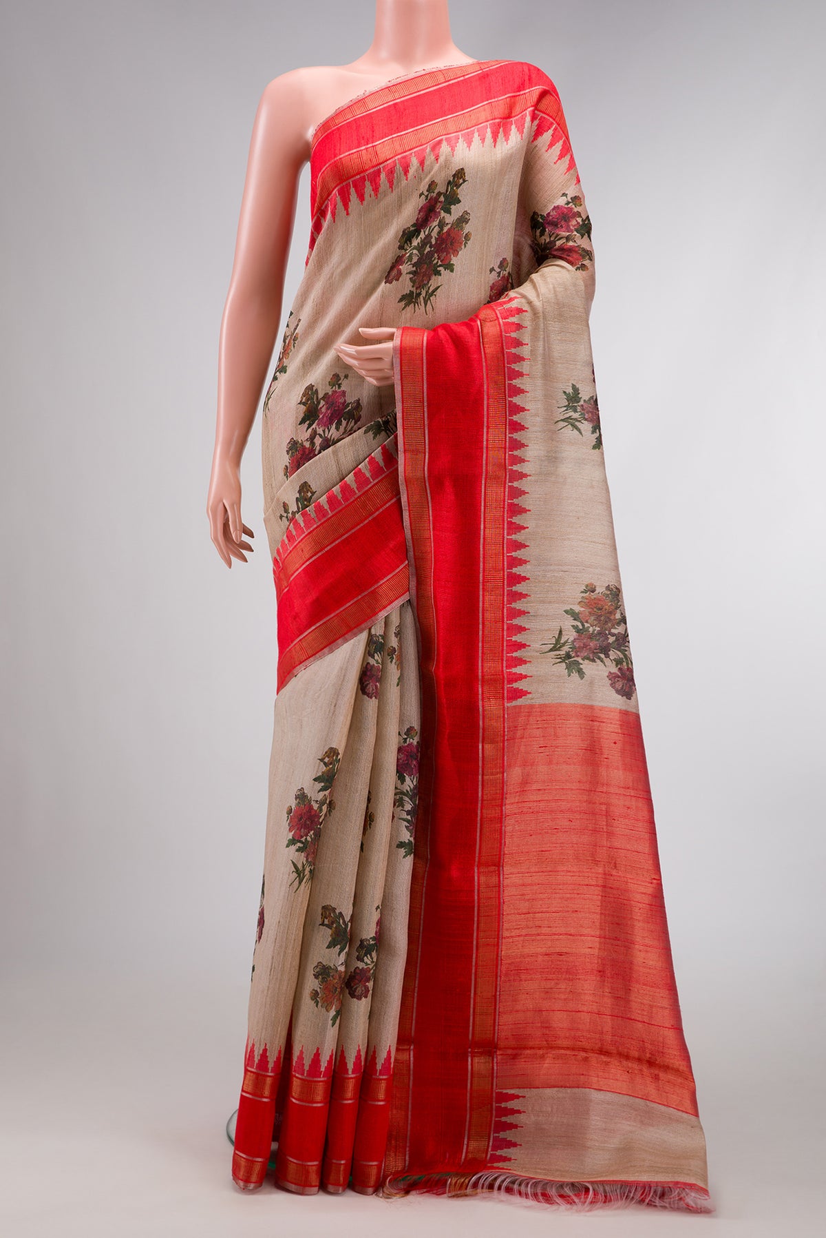 Beige Dual Tone Tussar Silk Saree with Printed design on the body and Temple Border.  displayed on a mannequin