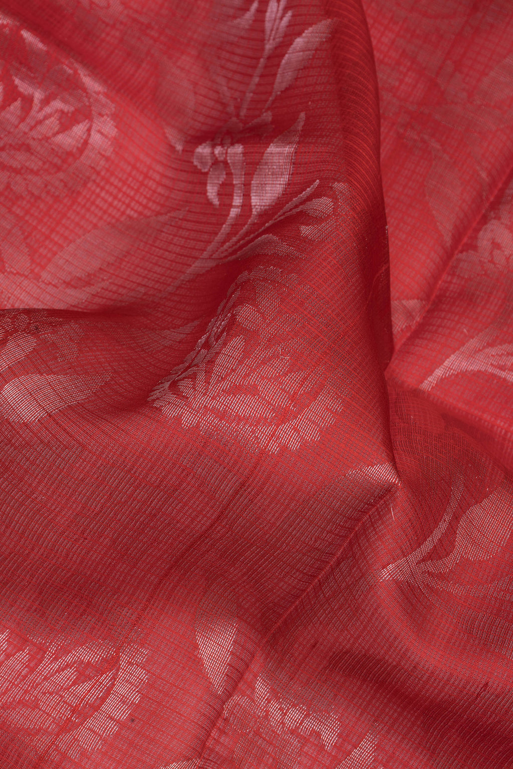 Close up of Red Kota Silk Saree with Zari Butta on the body and Zari Border.  displaying folds