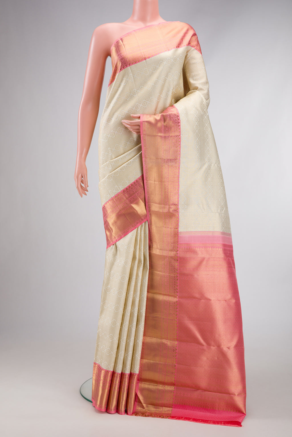 Pure Silk Pure Zari Off White Dual Tone Kanjivaram Saree with Zari Brocade on the body and Zari Border.  displayed on a mannequin
