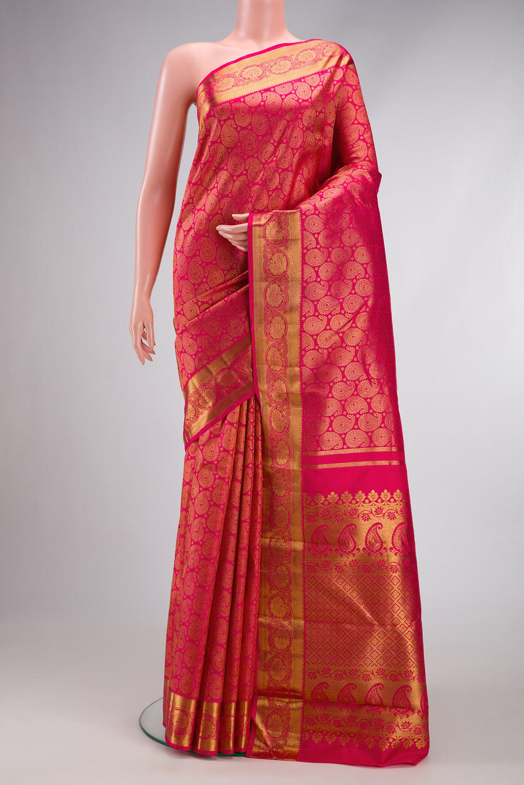Pure Silk Pure Zari Pink Dual Tone Kanjivaram Saree with Zari Brocade on the body and Zari Border.  displayed on a mannequin