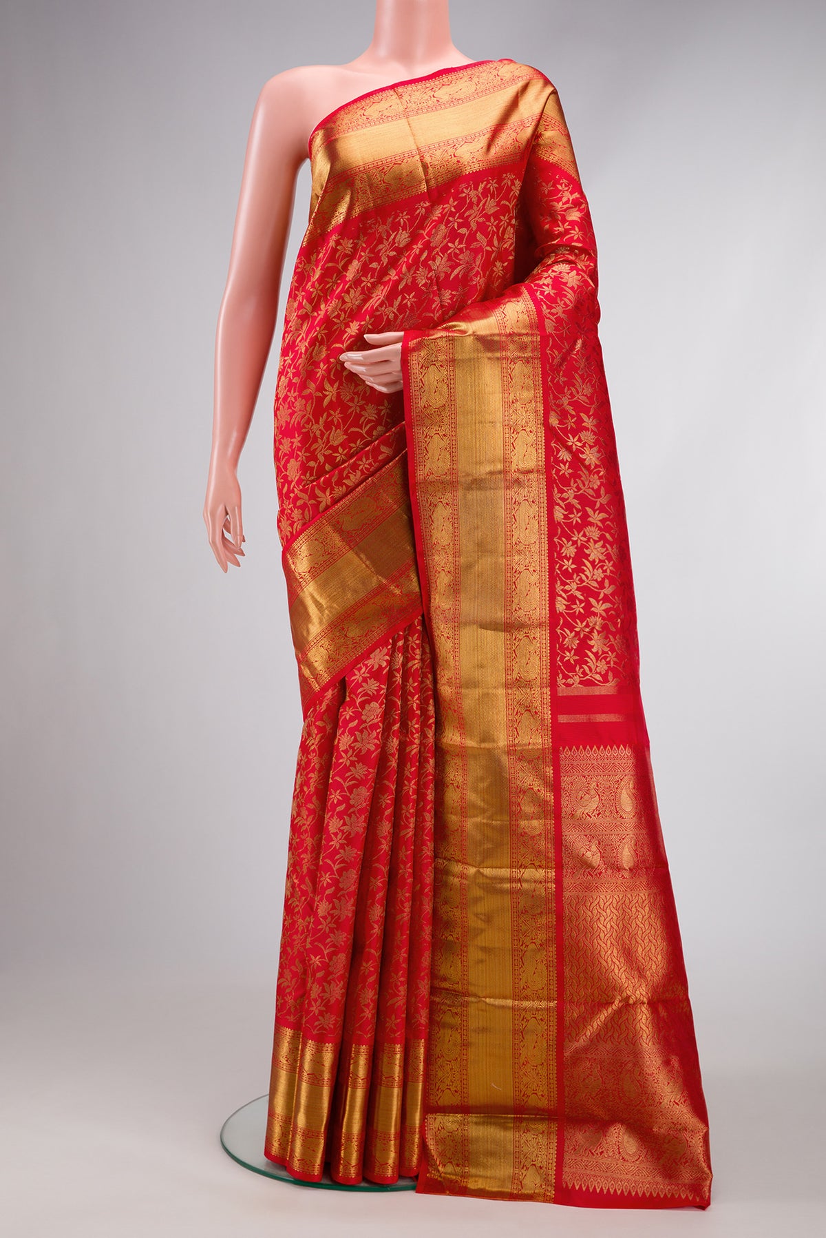 Pure Silk Pure Zari Red Dual Tone Kanjivaram Saree with Zari Brocade on the body and Zari Border.  displayed on a mannequin