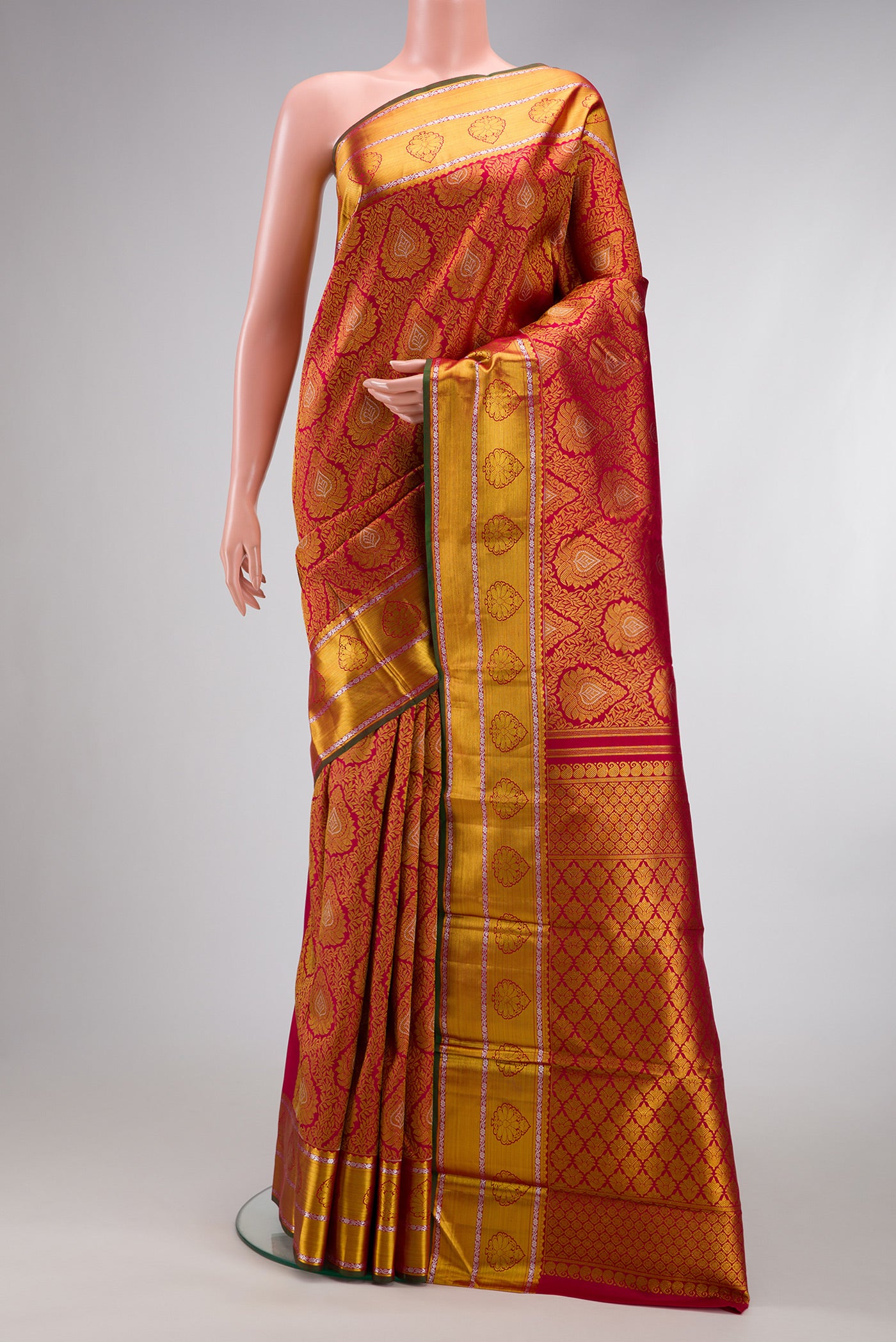 Maroon Dual Tone Kanjivaram Silk Saree with Zari Brocade on the body and Zari Border.  displayed on a mannequin