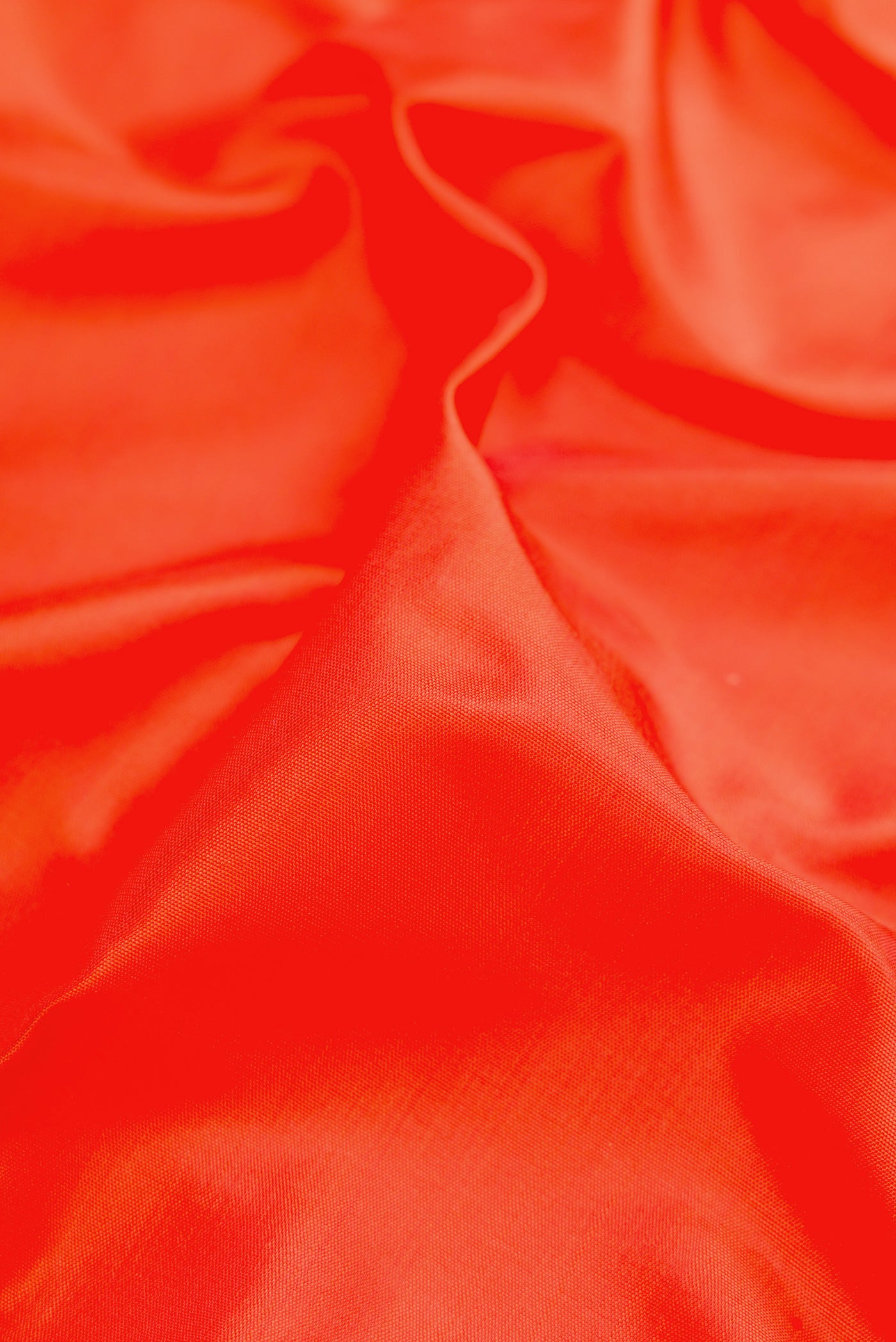 Close up of Pure Silk Pure Zari Orange Kanchipuram Nine Yards Saree with Plain Body and Zari Border.  displaying folds
