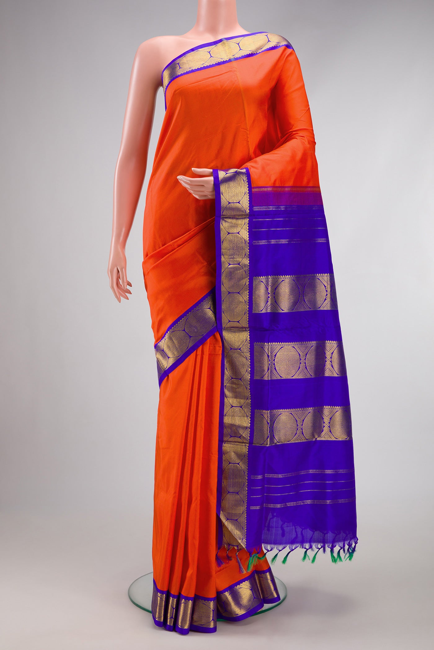 Pure Silk Pure Zari Orange Kanchipuram Nine Yards Saree with Plain Body and Zari Border.  displayed on a mannequin