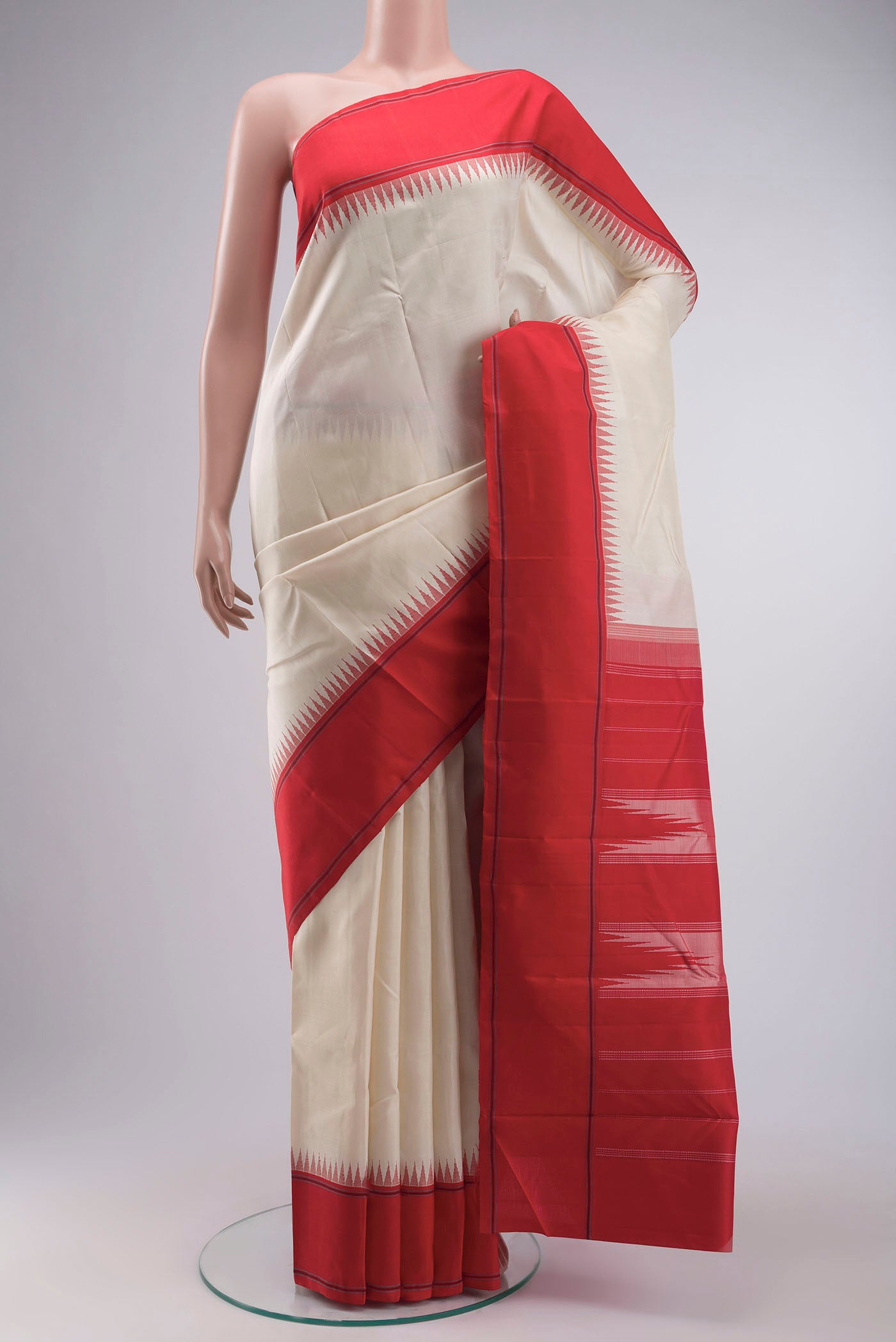 Cream Kanchipuram Silk Saree with Plain Body and Temple Border displayed on a mannequin