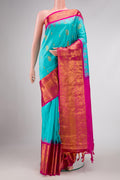 Sky Blue Dual Tone Gadwal Silk Saree with Zari Butta on the body and Zari Border displayed on a mannequin