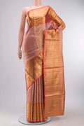 Pink with Gold Color Kanchipuram Tissue Silk Saree with Zari Brocade on the body and Zari Border displayed on a mannequin