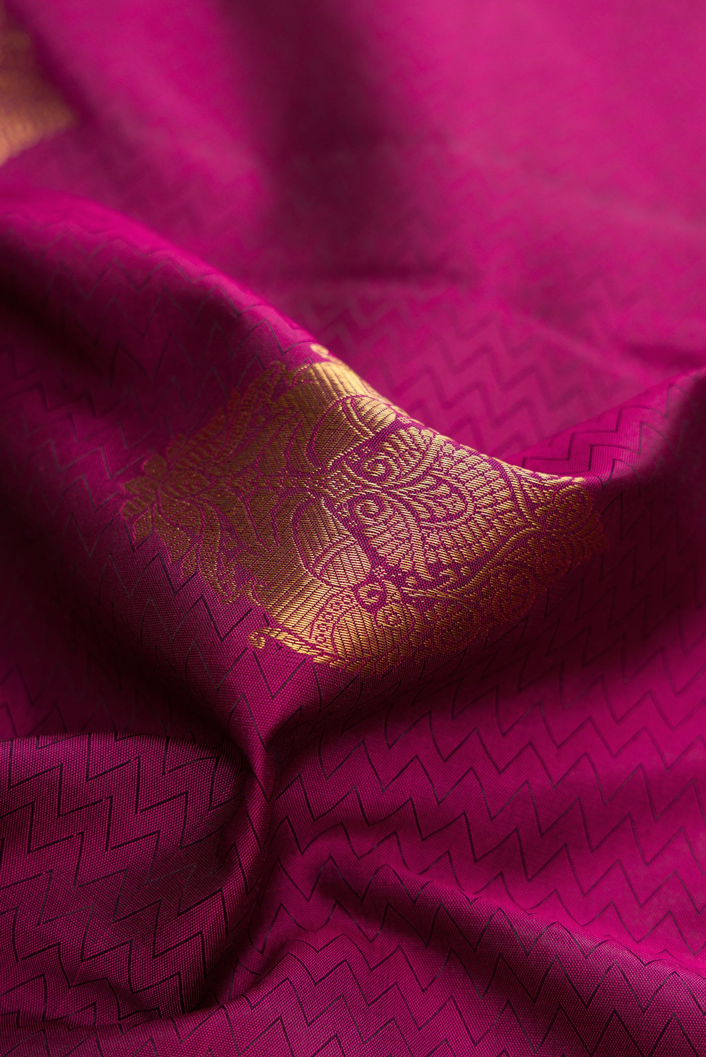 Close up of Purple Dual Tone Kanjivaram Silk Nine Yards Saree with Jacquard With Zari Butta on the body and Zari Border.  displaying folds