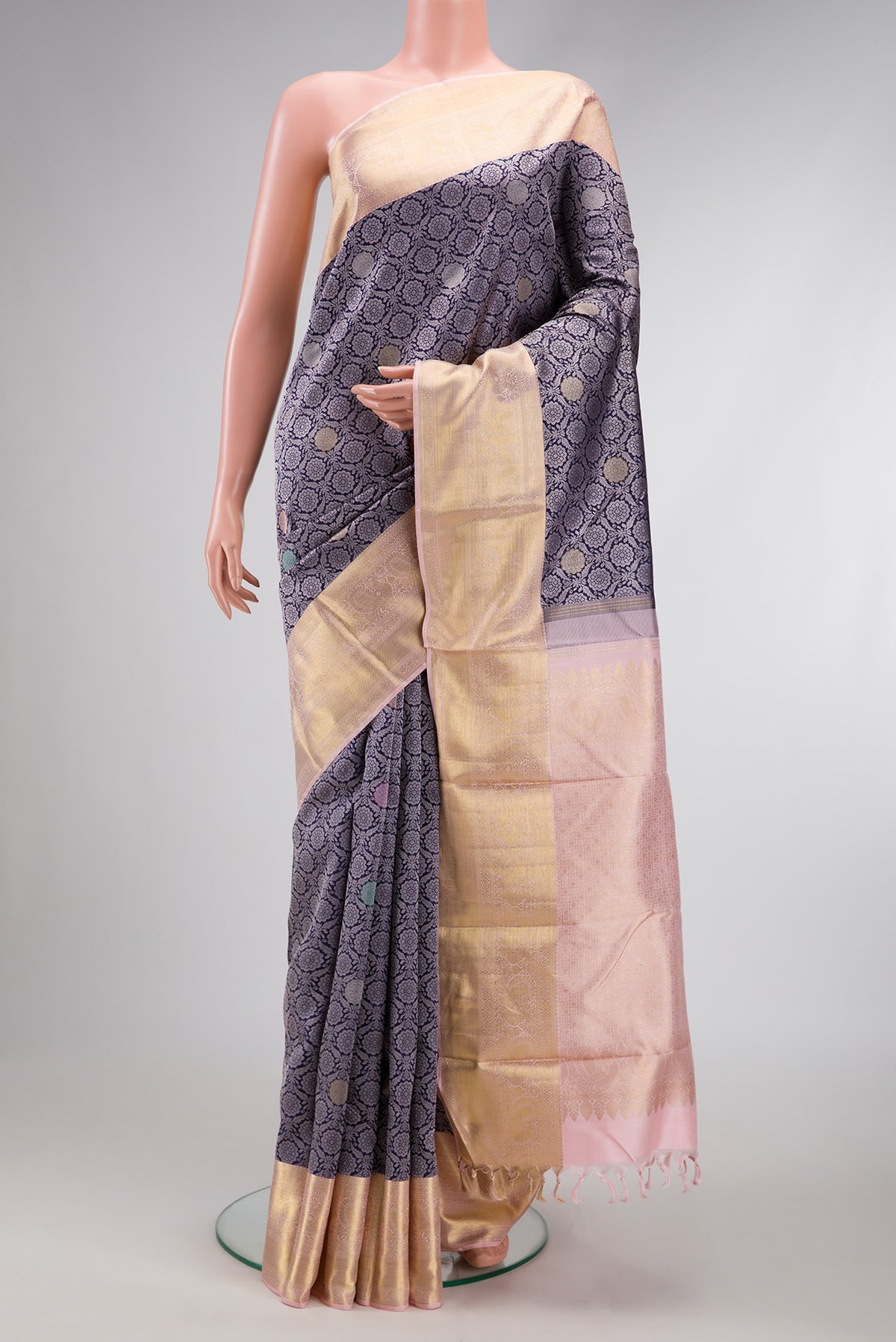 Navy Blue Kanjivaram Silk Saree with Jacquard With Zari Butta on the body and Zari Border.  displayed on a mannequin