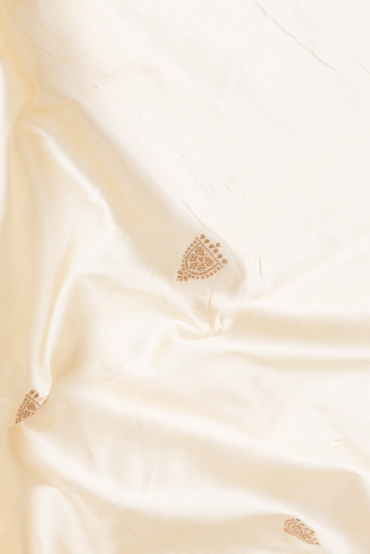 Close up of Sandal Dual Tone Banarasi Silk Saree with Zari Butta on the body and Zari Border.  displaying folds