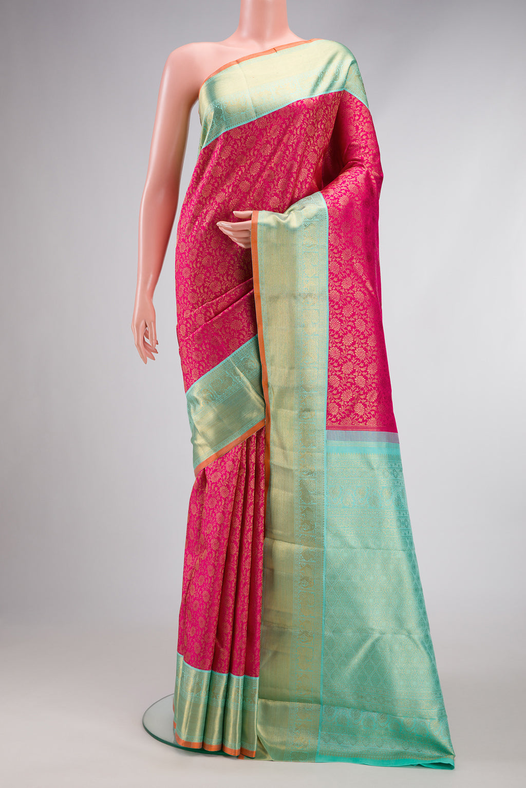 Pure Silk Pure Zari Dark Pink Dual Tone Kanjivaram Saree with Zari Brocade on the body and Zari Border.  displayed on a mannequin