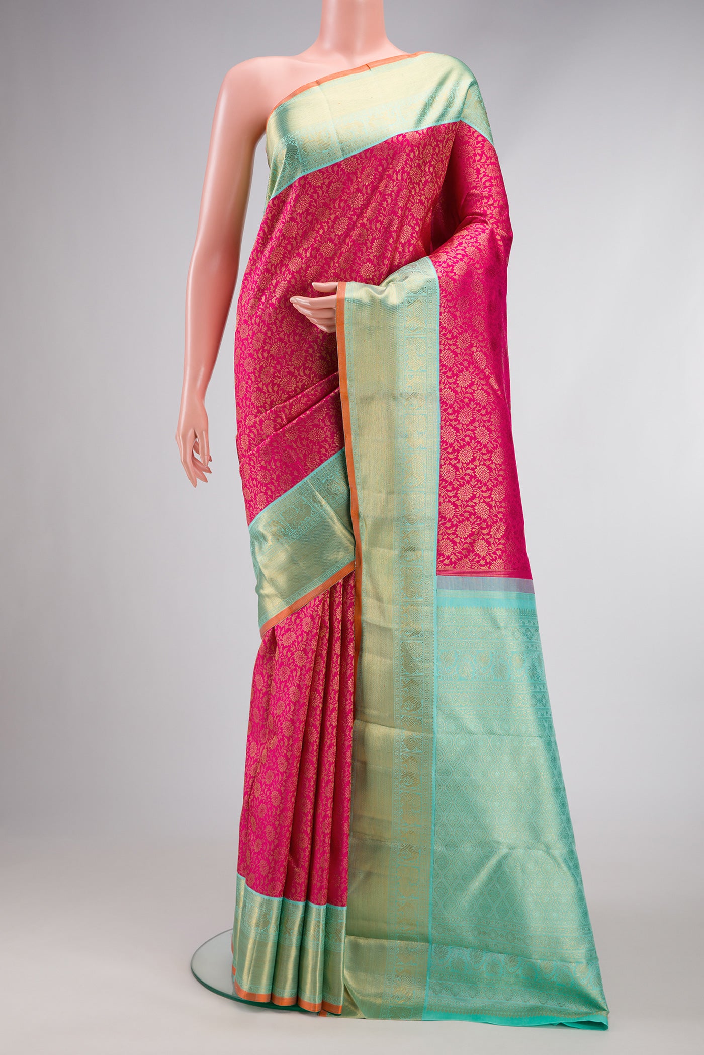 Pure Silk Pure Zari Dark Pink Dual Tone Kanjivaram Saree with Zari Brocade on the body and Zari Border.  displayed on a mannequin