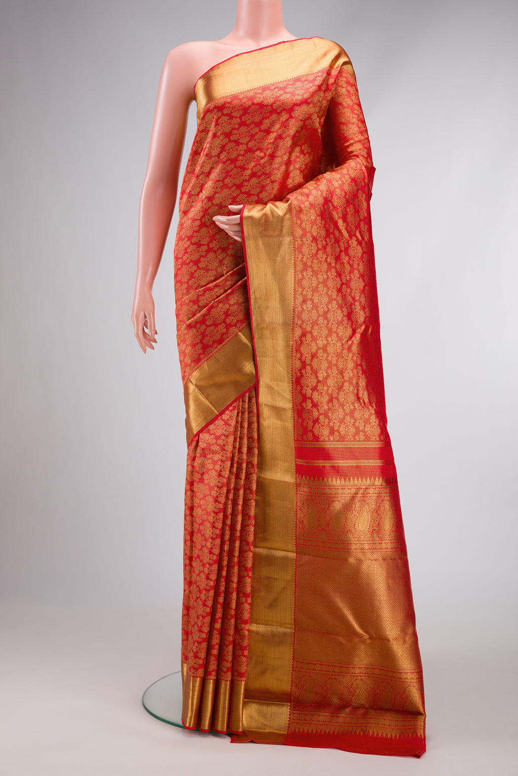 Pure Silk Pure Zari Red Dual Tone Kanjivaram Saree with Zari Brocade on the body and Zari Border.  displayed on a mannequin